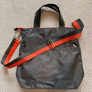 Stylish Black Tote Bag with Red and Green Strap